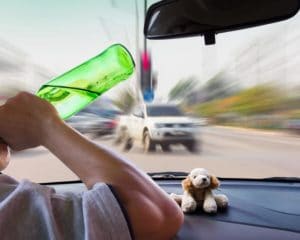 A drunk driver is shown about to cause a car accident.