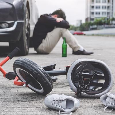 A drunk driver is shown shocked and mourning after having hit a pedestrian