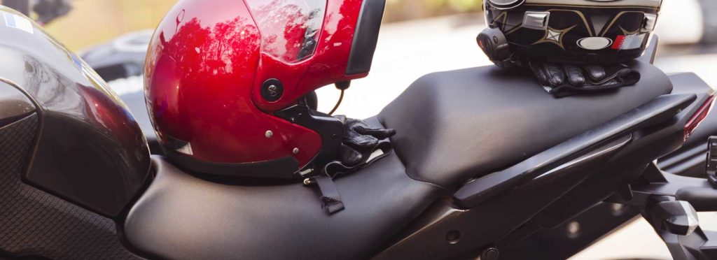 Picture of a motorcycle with helmets on it