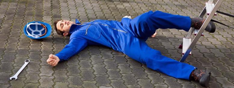 worker lays on floor after workplace accident