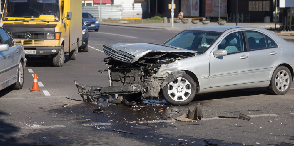 An accident involving a silver car.